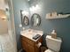Bathroom with a decorative framed mirror, lighting, and stylish decor at 2270 Canyon Song Ave, Laughlin, NV 89029