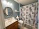 The updated bathroom featuring a vanity with wood cabinets and a tub and shower combo at 2270 Canyon Song Ave, Laughlin, NV 89029
