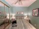 Bedroom showcasing mirrored closet doors, neutral paint and carpet, plus matching nightstands and lamps at 2270 Canyon Song Ave, Laughlin, NV 89029