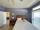 Well-lit bedroom featuring a comfortable bed and a doorway leading to the kitchen at 2270 Canyon Song Ave, Laughlin, NV 89029