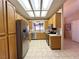 The kitchen is equipped with wooden cabinets, stainless steel appliances and recessed lighting at 2270 Canyon Song Ave, Laughlin, NV 89029