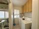 This laundry room has a washing machine and dryer with tile flooring and access to a nook at 2270 Canyon Song Ave, Laughlin, NV 89029