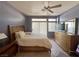 Bright main bedroom offering plenty of natural light, modern furniture and tiled floors at 2270 Canyon Song Ave, Laughlin, NV 89029