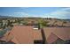 Expansive aerial view of community featuring landscaped grounds and residential buildings with Spanish tile roofs at 2300 E Silverado Ranch Blvd # 1070, Las Vegas, NV 89183