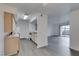 Open kitchen featuring wood cabinets, white appliances, and gray wood-look floors at 2300 E Silverado Ranch Blvd # 1070, Las Vegas, NV 89183