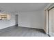 Bright living room features neutral paint, wood-look flooring and outdoor access at 2300 E Silverado Ranch Blvd # 1070, Las Vegas, NV 89183