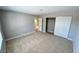 Bright bedroom features neutral walls, plush carpet and sliding door closet at 2428 Greens Ave, Henderson, NV 89014