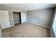 Bedroom with a sliding door closet, plush carpet, and neutral colored walls at 2428 Greens Ave, Henderson, NV 89014