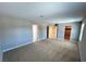 Bedroom with large carpeted floor and multiple entrances to the bathroom and closet at 2428 Greens Ave, Henderson, NV 89014