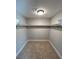 Walk in closet with a clothes hanging rod and carpeted floor at 2428 Greens Ave, Henderson, NV 89014