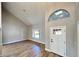 Inviting entryway showcases vaulted ceilings, a large window, and durable wood-look flooring at 2428 Greens Ave, Henderson, NV 89014