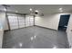Spacious garage with epoxy flooring, a white door, and recessed lighting at 2428 Greens Ave, Henderson, NV 89014