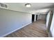 Hallway with wood-look floors that provides access to multiple rooms at 2428 Greens Ave, Henderson, NV 89014