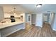 Updated kitchen featuring modern cabinets, stainless appliances, and an eat-in bar at 2428 Greens Ave, Henderson, NV 89014