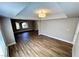 Open living space with wood flooring, a tray ceiling, and plenty of natural light at 2428 Greens Ave, Henderson, NV 89014