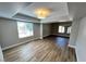 Open-concept living room boasts wood floors, recessed lighting, and spacious layout at 2428 Greens Ave, Henderson, NV 89014