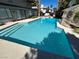 Backyard pool with pristine blue water, steps and gazebo in a well-landscaped outdoor living space at 2428 Greens Ave, Henderson, NV 89014
