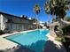 A spacious backyard pool with a gazebo, surrounded by lush greenery and palm trees at 2428 Greens Ave, Henderson, NV 89014