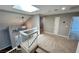View from the top of the staircase, showcasing the open landing and front entryway at 2428 Greens Ave, Henderson, NV 89014