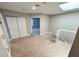 Carpeted upstairs landing with closet space, skylight, and view of the bedroom at 2428 Greens Ave, Henderson, NV 89014