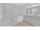 Bathroom featuring a glass-enclosed shower, soaking tub, and double sink vanity at 2449 Padulle Pl, Henderson, NV 89044