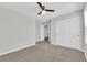 Bedroom boasts a ceiling fan, carpet flooring, and closet space, offering comfort and storage at 2449 Padulle Pl, Henderson, NV 89044