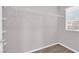 Walk-in closet with wire shelving and a window providing natural light at 2449 Padulle Pl, Henderson, NV 89044