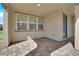 A covered patio with brick flooring offers a cozy outdoor living space at 2449 Padulle Pl, Henderson, NV 89044