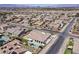 Expansive aerial view of a desert home with a private pool and lush landscaping in a residential neighborhood at 2804 Candelaria Dr, Henderson, NV 89074