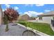 Spacious backyard featuring lush green grass, trees, and beautiful landscaping at 2804 Candelaria Dr, Henderson, NV 89074