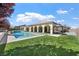 Stunning backyard showcasing a swimming pool, gazebo, and well-manicured lawn at 2804 Candelaria Dr, Henderson, NV 89074