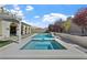 Relaxing backyard featuring a pool, spa, pergola, manicured trees, and tasteful landscaping at 2804 Candelaria Dr, Henderson, NV 89074