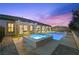 Beautiful backyard showcasing pool, spa, covered patio, and well-manicured landscaping at 2804 Candelaria Dr, Henderson, NV 89074