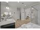 Bathroom featuring marble countertops, double vanity sinks, soaking tub and separate glass shower at 2804 Candelaria Dr, Henderson, NV 89074