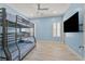 bedroom with a bunk bed, ceiling fan and tile floor at 2804 Candelaria Dr, Henderson, NV 89074