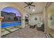 Relaxing covered patio with comfortable seating and views of the pool and well-maintained backyard at 2804 Candelaria Dr, Henderson, NV 89074