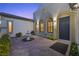 Charming front yard with decorative fountain and brick-paved entrance to the house at 2804 Candelaria Dr, Henderson, NV 89074