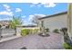 Charming courtyard featuring a water fountain and paved patio with manicured landscaping at 2804 Candelaria Dr, Henderson, NV 89074