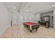 Elegant game room with a pool table and open layout connecting to living and dining areas at 2804 Candelaria Dr, Henderson, NV 89074