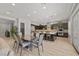 Spacious kitchen with modern appliances, dark cabinetry, and a center island perfect for dining at 2804 Candelaria Dr, Henderson, NV 89074