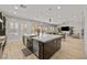 Modern kitchen boasts an island with seating and stainless steel appliances, great for gathering at 2804 Candelaria Dr, Henderson, NV 89074