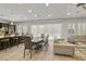 Open-concept living space with a kitchen island, dining table, and comfortable seating area at 2804 Candelaria Dr, Henderson, NV 89074