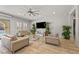 Bright and airy living room with stylish furnishings, large windows, and views of the outdoor area at 2804 Candelaria Dr, Henderson, NV 89074