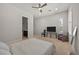 Spacious main bedroom with neutral carpet, plantation shutters, TV and comfortable furniture at 2804 Candelaria Dr, Henderson, NV 89074