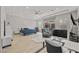Spacious main bedroom with hardwood floors, modern furniture, a desk and a view of the backyard pool at 2804 Candelaria Dr, Henderson, NV 89074