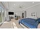 Spacious main bedroom with hardwood floors, modern furniture and sliding doors leading to the backyard at 2804 Candelaria Dr, Henderson, NV 89074