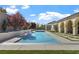 Inviting backyard pool and spa featuring lush landscaping and a covered patio area at 2804 Candelaria Dr, Henderson, NV 89074