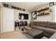 Bonus room features carpet, wall-mounted TV, and shelving for decor at 2871 Cabrillo Terrace St, Henderson, NV 89044