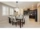 Dining area with modern chandelier and views into the open-concept kitchen at 2871 Cabrillo Terrace St, Henderson, NV 89044
