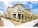 Charming home with a well-maintained front yard, stone accents, and neutral color palette at 2871 Cabrillo Terrace St, Henderson, NV 89044